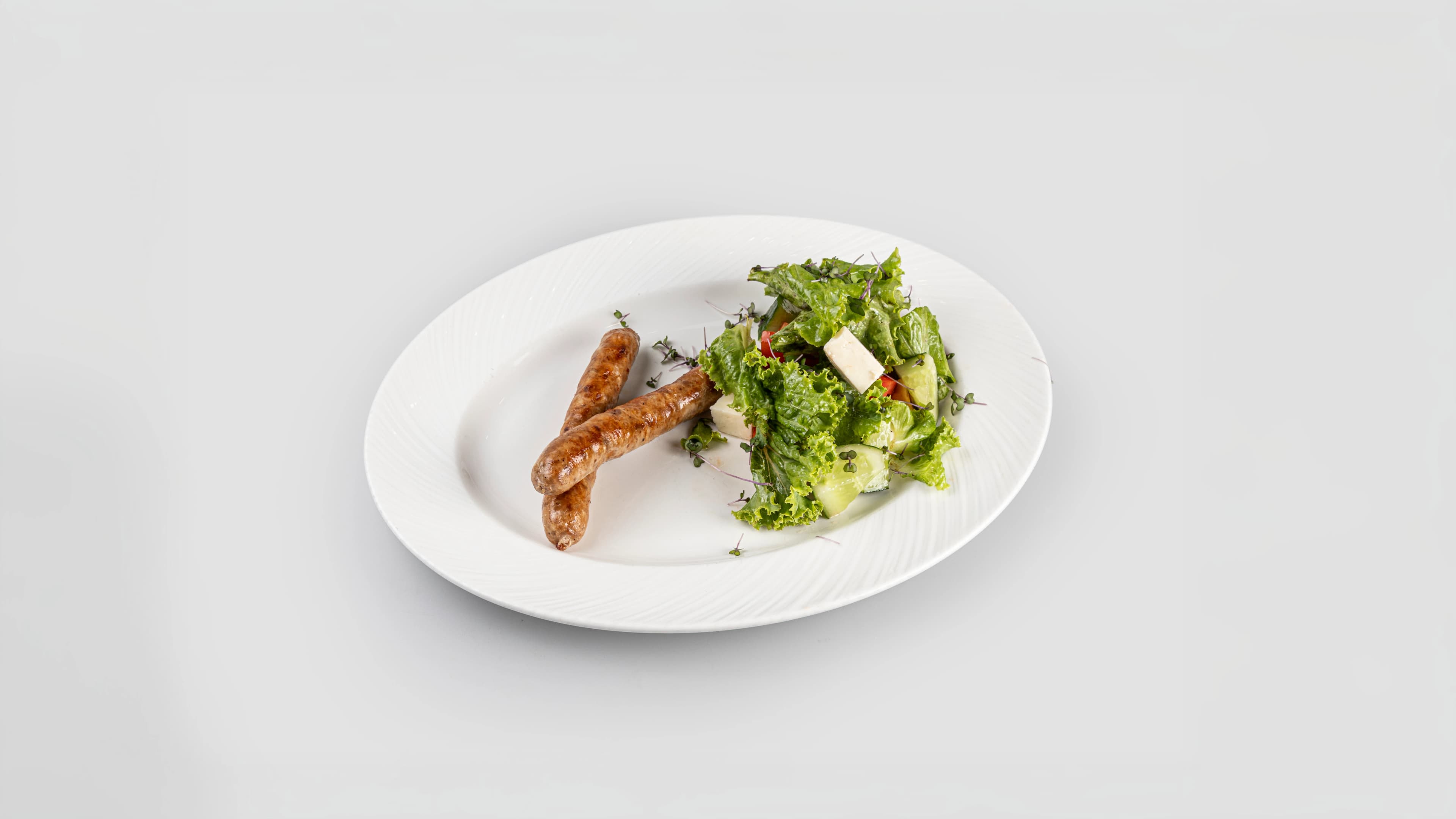 Изображение продукта Колбаски с микс салатом